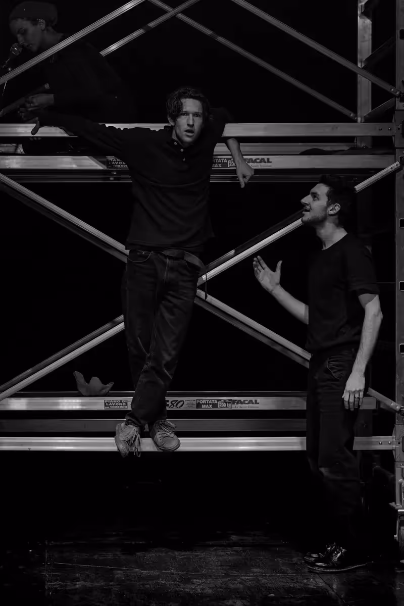 Festival di Spoleto performers on stage with dramatic black and white scaffolding
