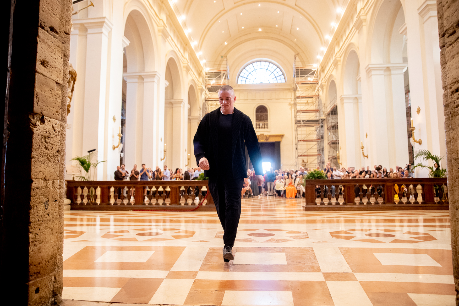 Festival di Spoleto: Artist walking on checkered floor in historic cathedral