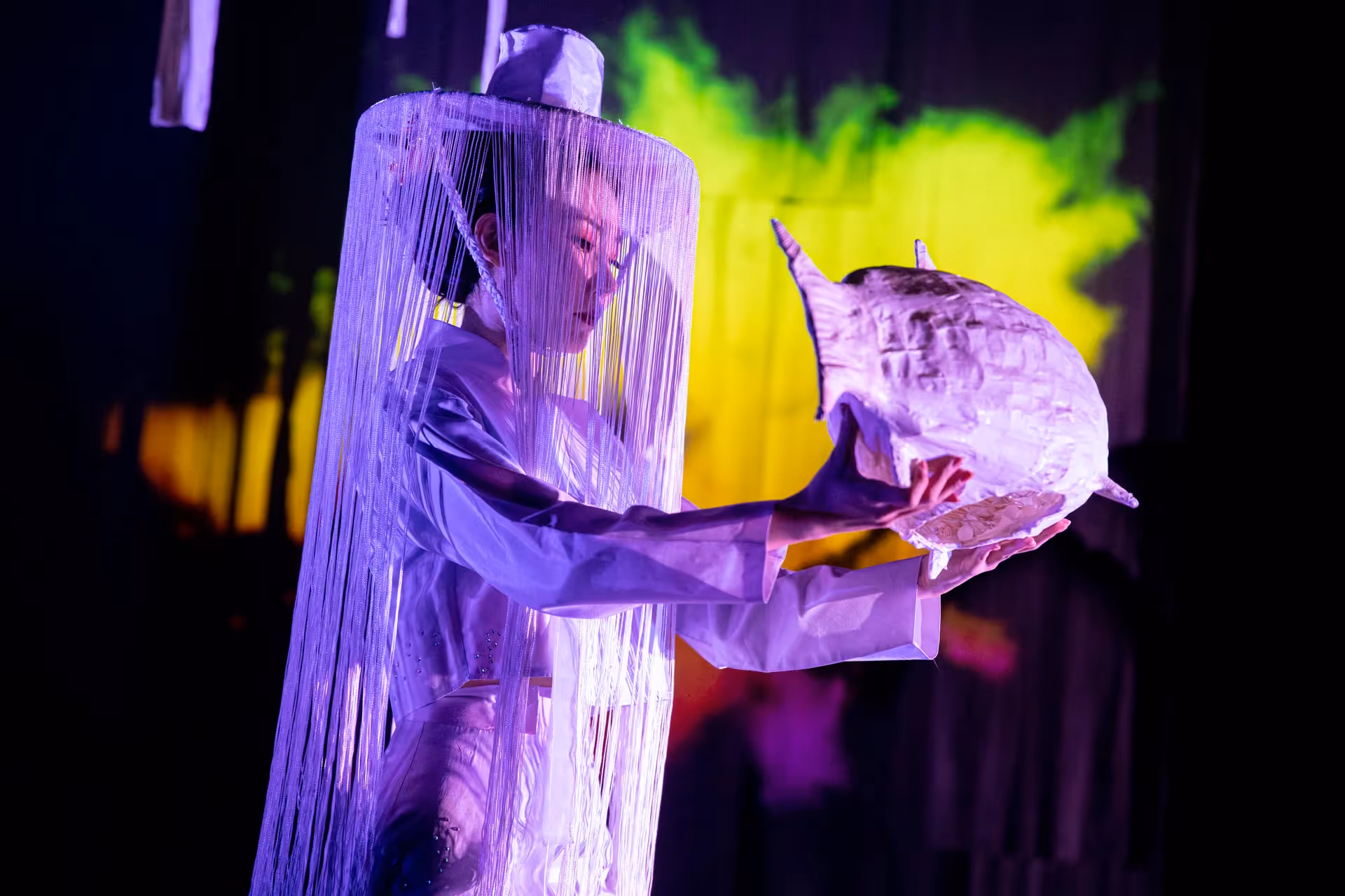 Experimental performance at Festival di Spoleto with vibrant purple stage design