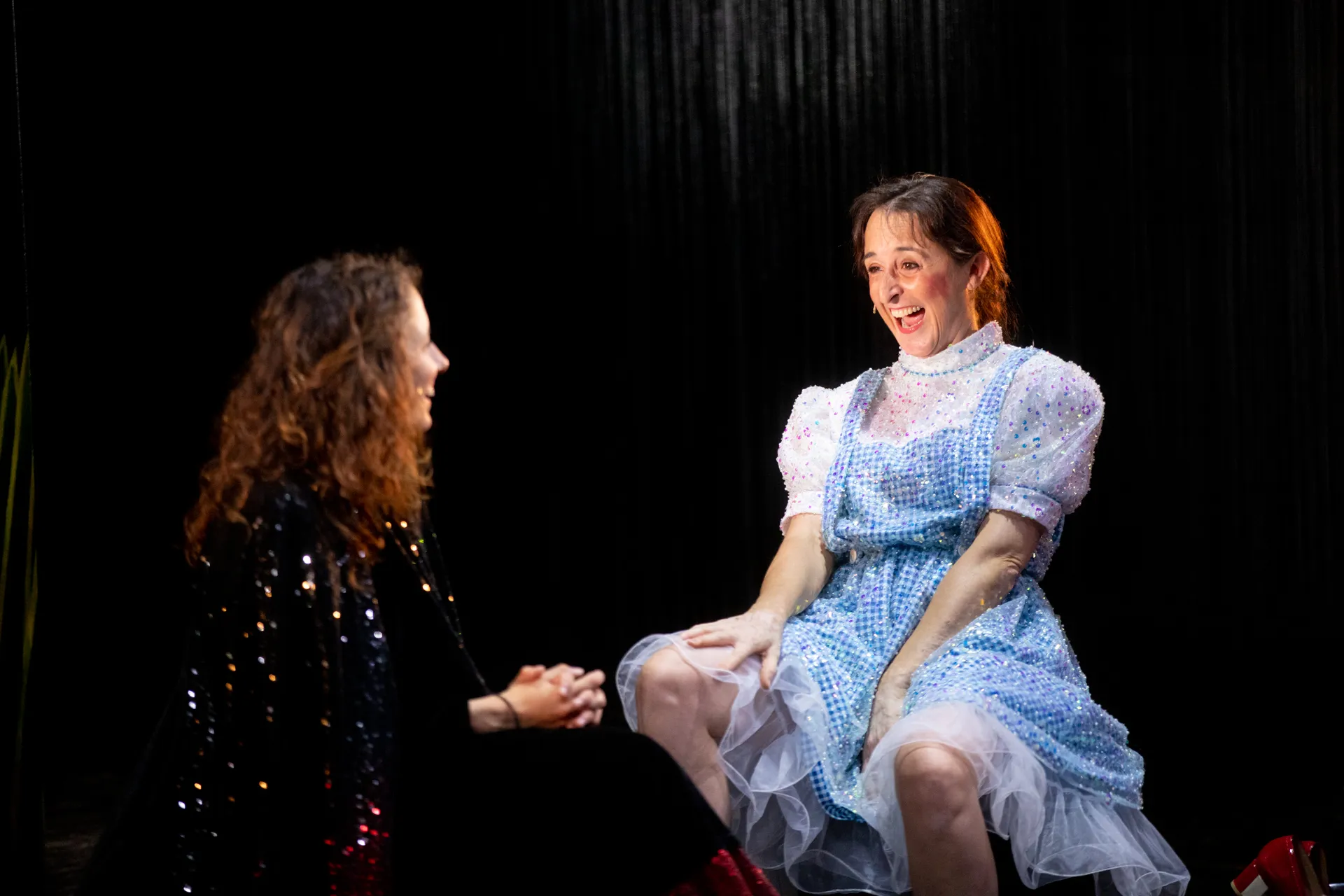 Joyful performer at Festival di Spoleto theatrical performance in sparkling dress