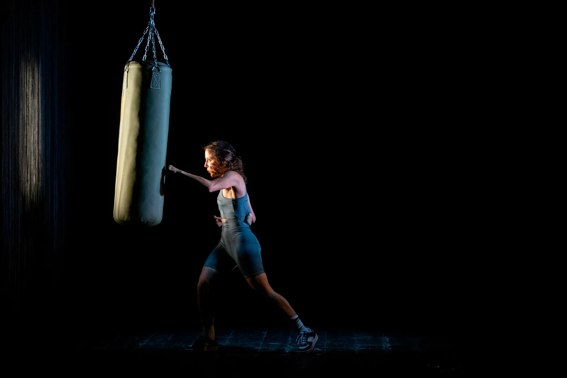 Festival di Spoleto performance: Athlete boxing with dramatic lighting