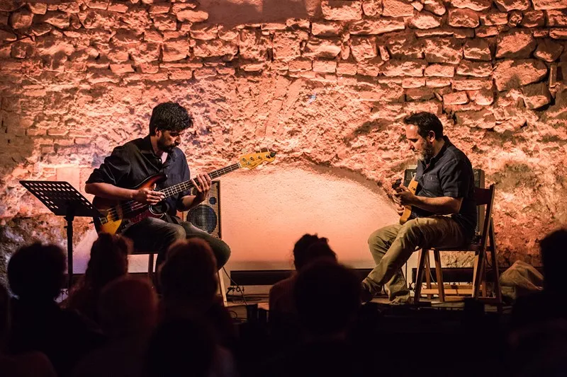 Festival di Spoleto musicians perform intimate acoustic concert against stone wall