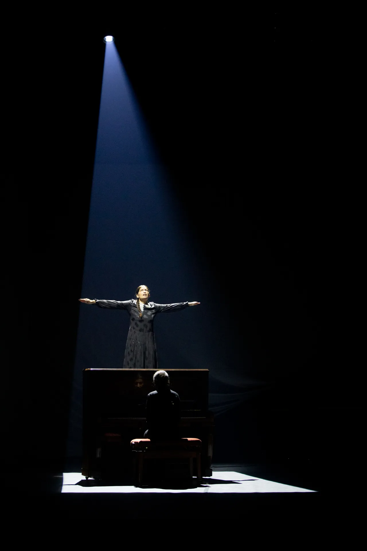 Dramatic stage performance at Festival di Spoleto with spotlight and performer