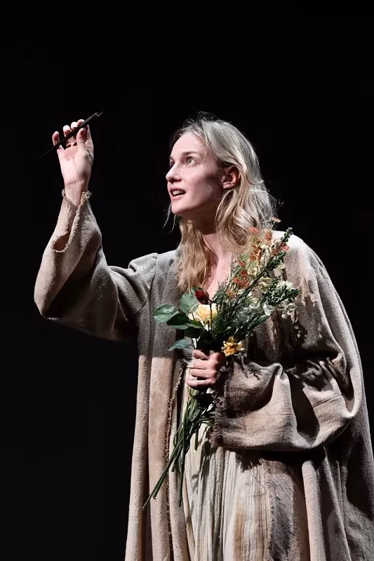 Actress performs dramatic scene at Festival di Spoleto with flowers and emotion