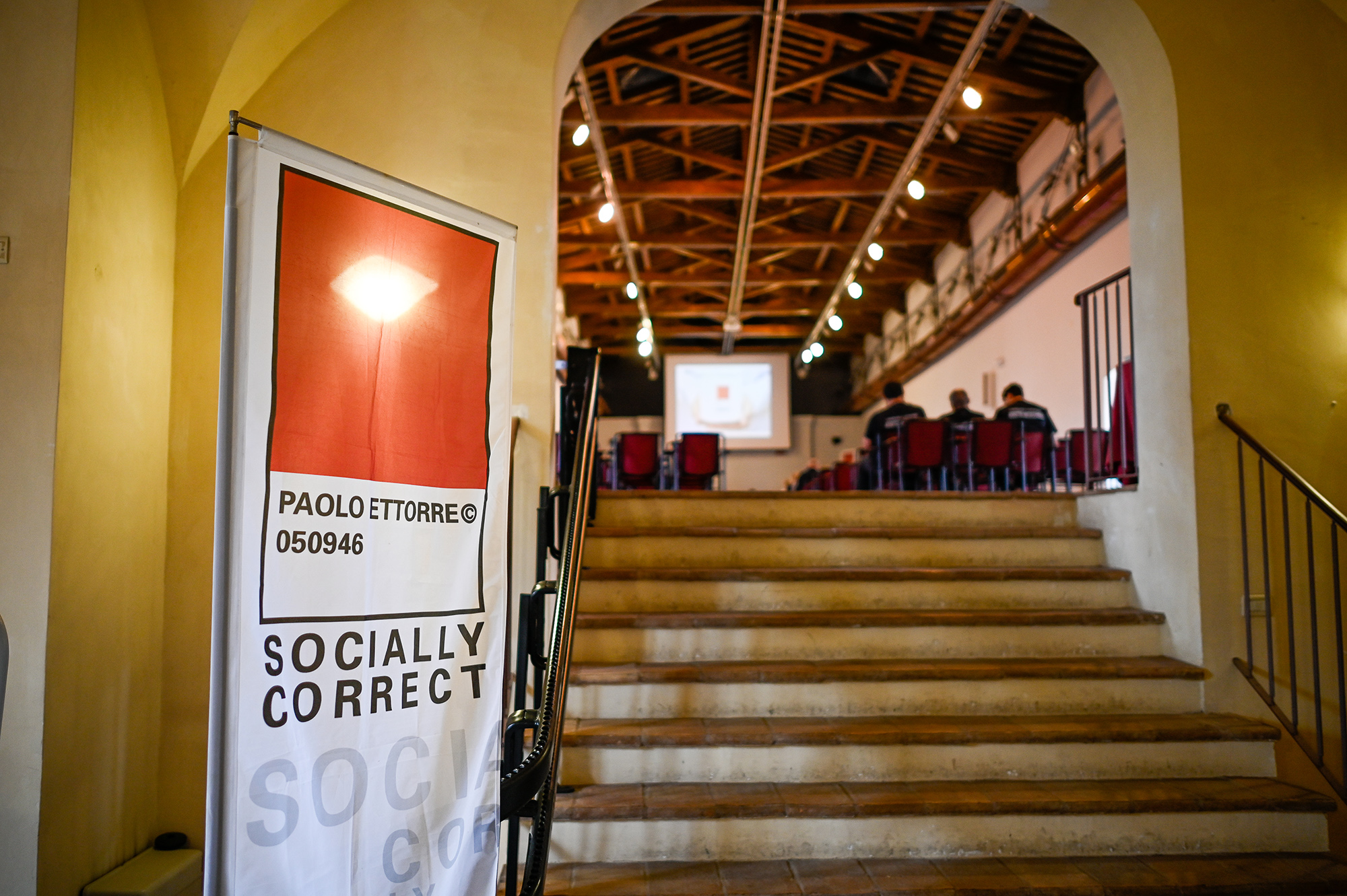 Festival di Spoleto: Socially Correct event with red poster in historic venue