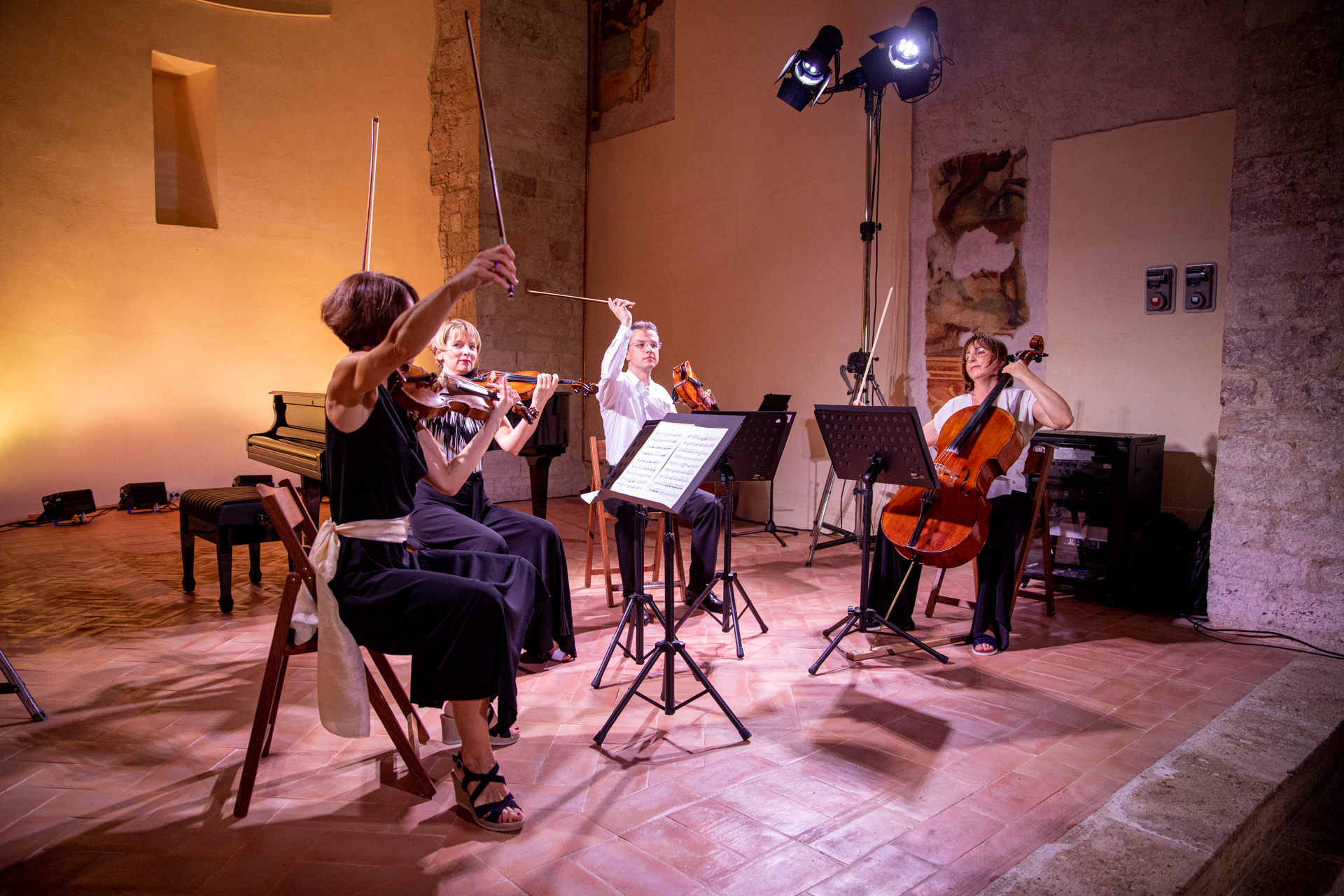 Female string quartet performing at Festival di Spoleto in intimate venue