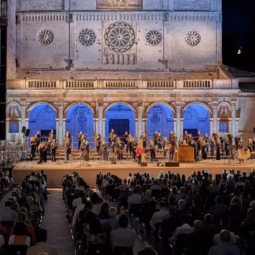 Festival di Spoleto concert with orchestra performing in historic architectural setting