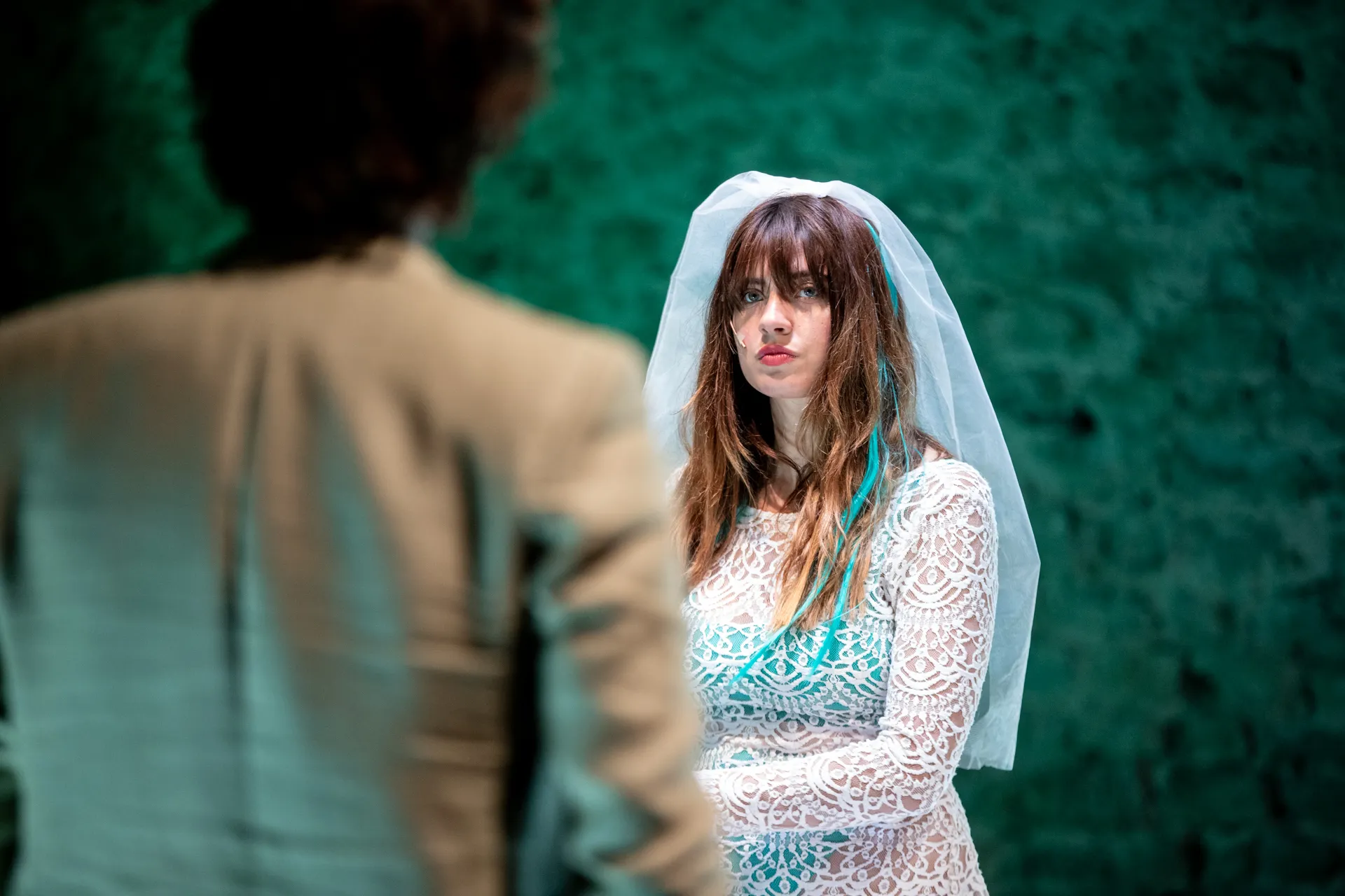Dramatic bride at Festival di Spoleto performance with intricate lace wedding dress