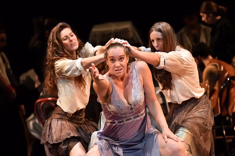 Dramatic theater performance at Festival di Spoleto with three actresses in costume