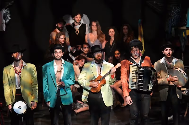 Performers in colorful jackets at Festival di Spoleto musical theater production