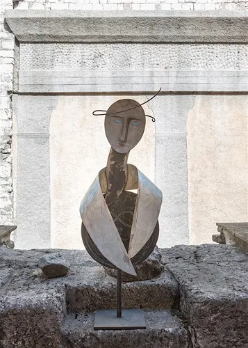 Abstract sculpture at Festival di Spoleto, minimalist human figure on stone surface