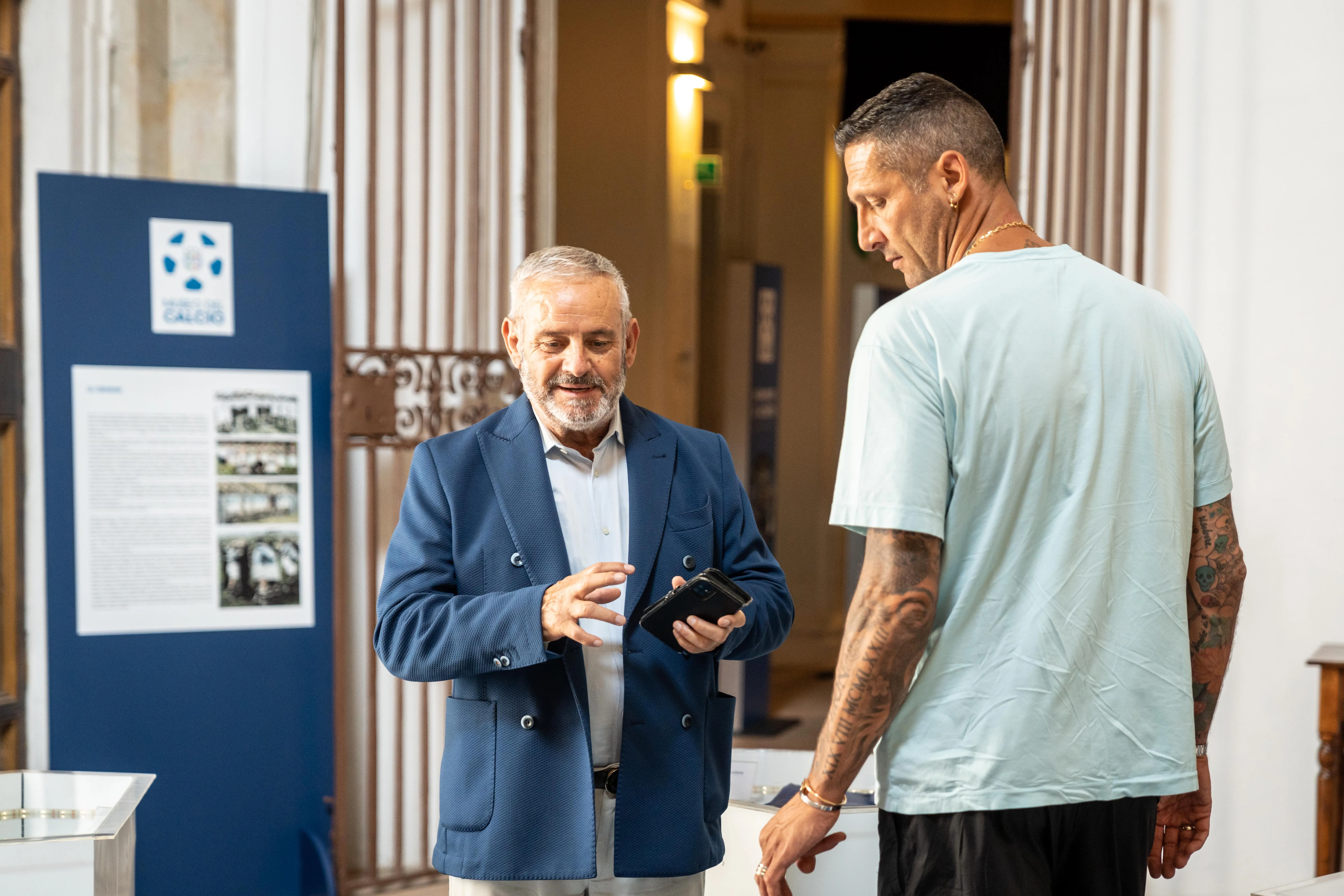 Festival di Spoleto event with two men discussing exhibition details