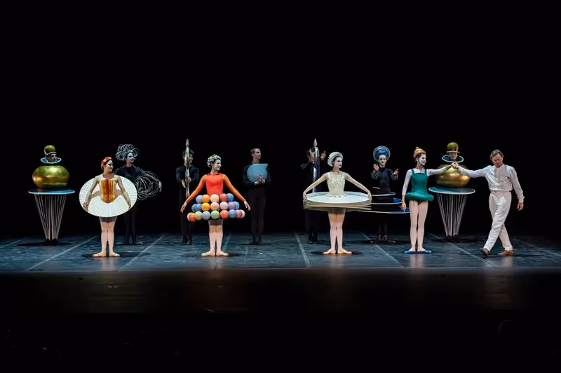 Festival di Spoleto performance with dancers in surreal geometric costumes on stage