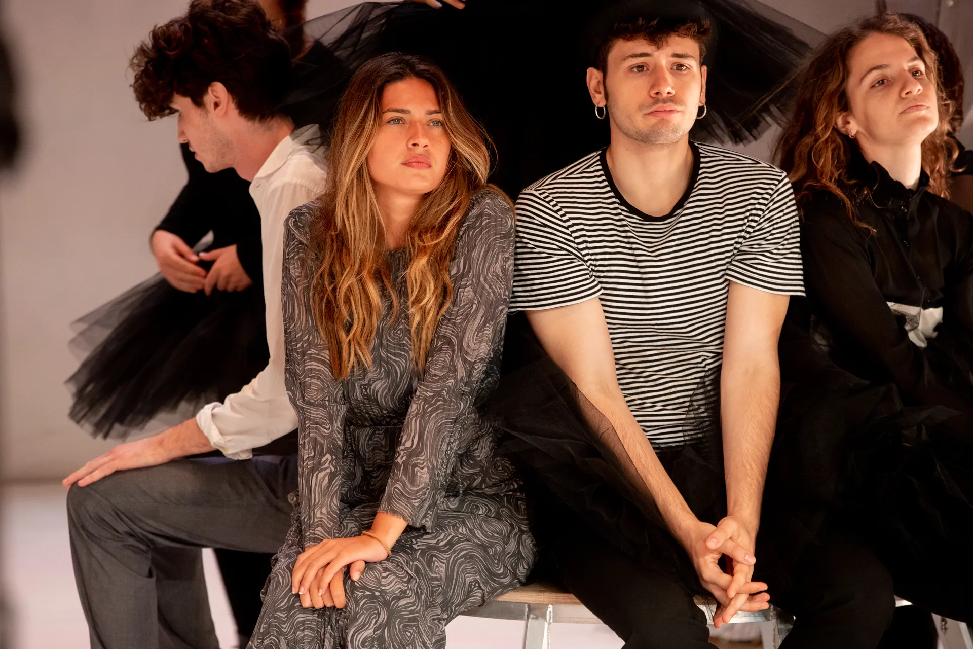 Festival di Spoleto performers pose dramatically in stylized contemporary costumes