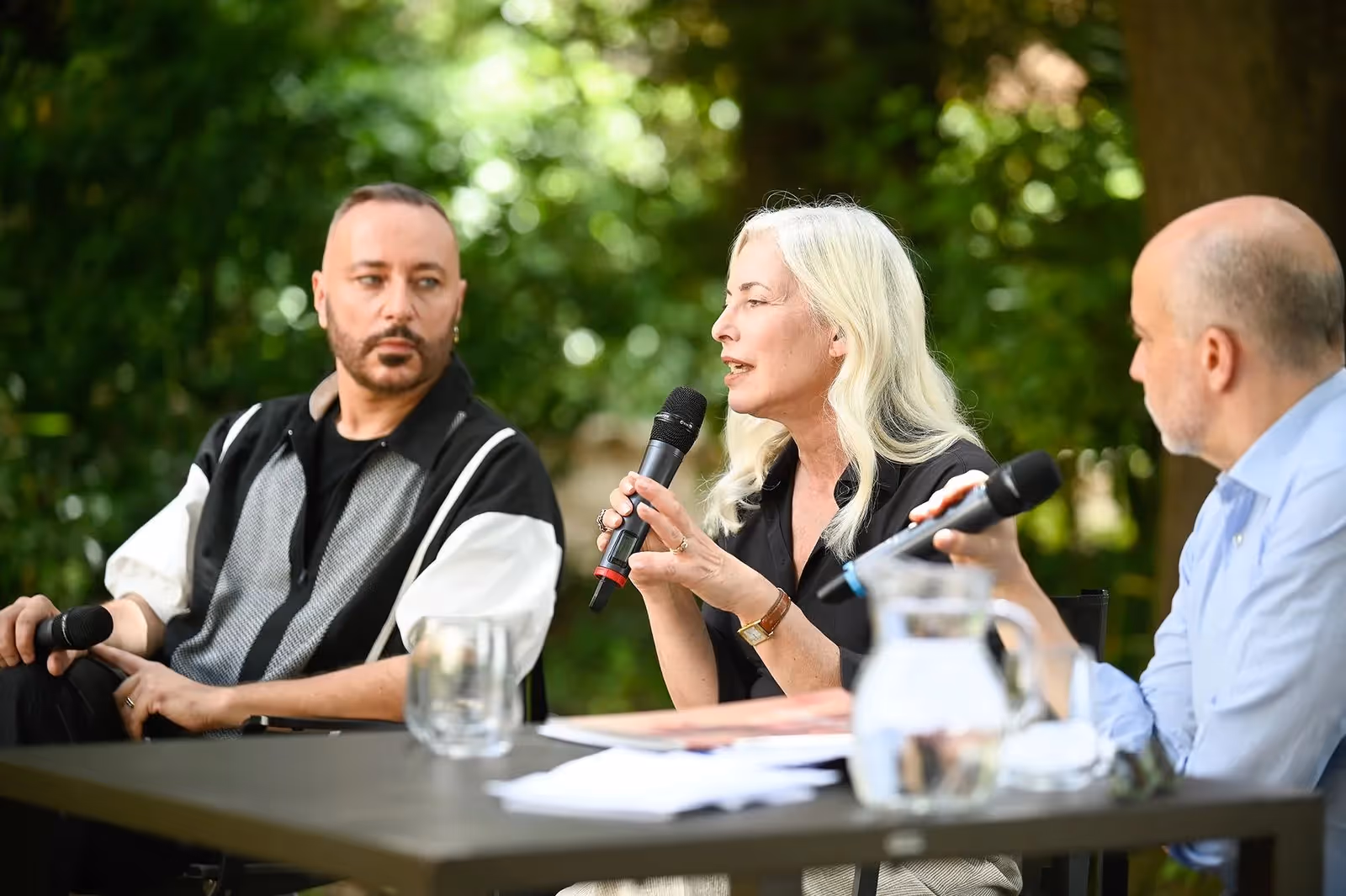 Festival di Spoleto panel discussion with three speakers outdoors