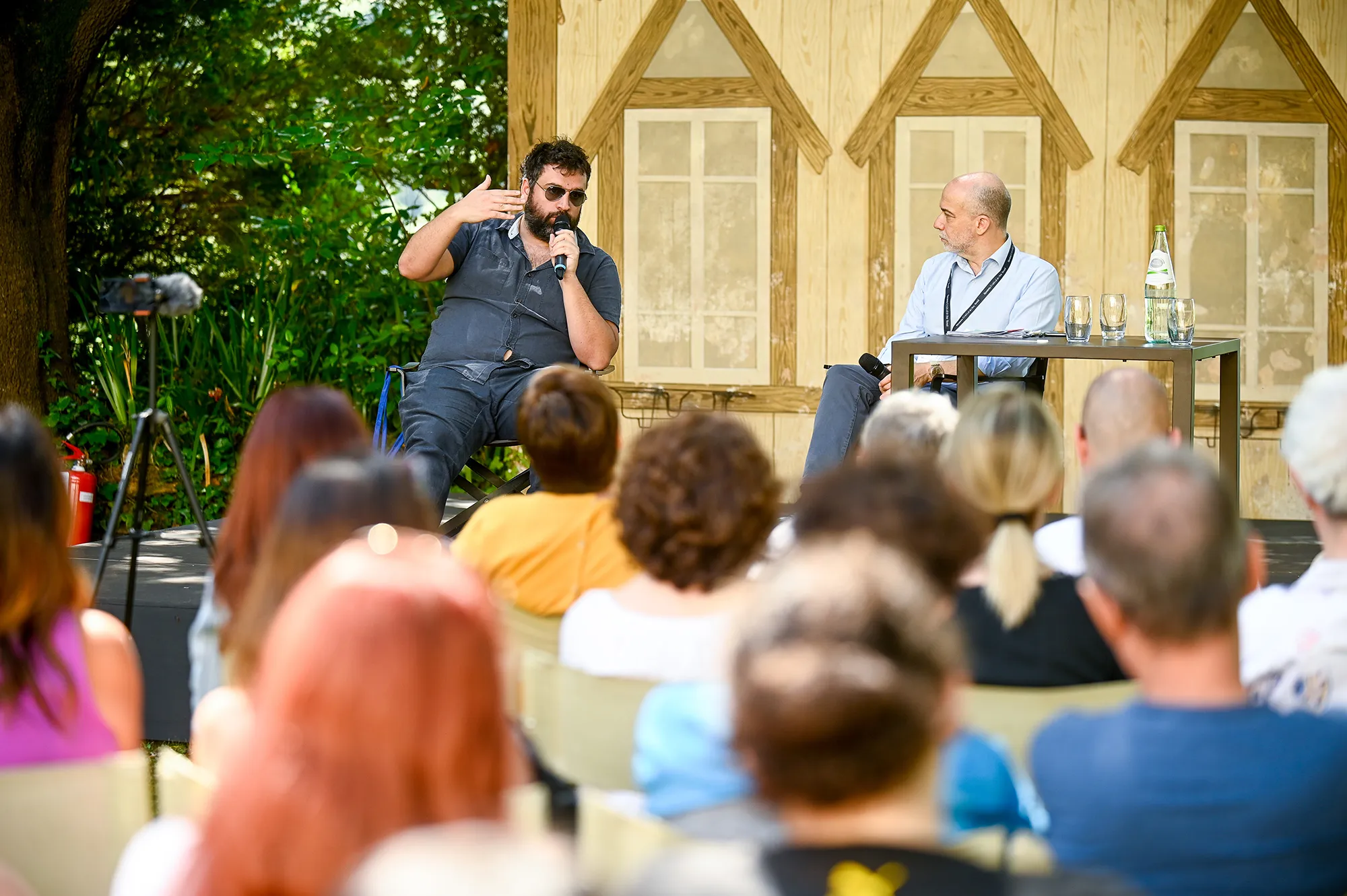 Speaker presenting at Festival di Spoleto cultural event with engaged audience