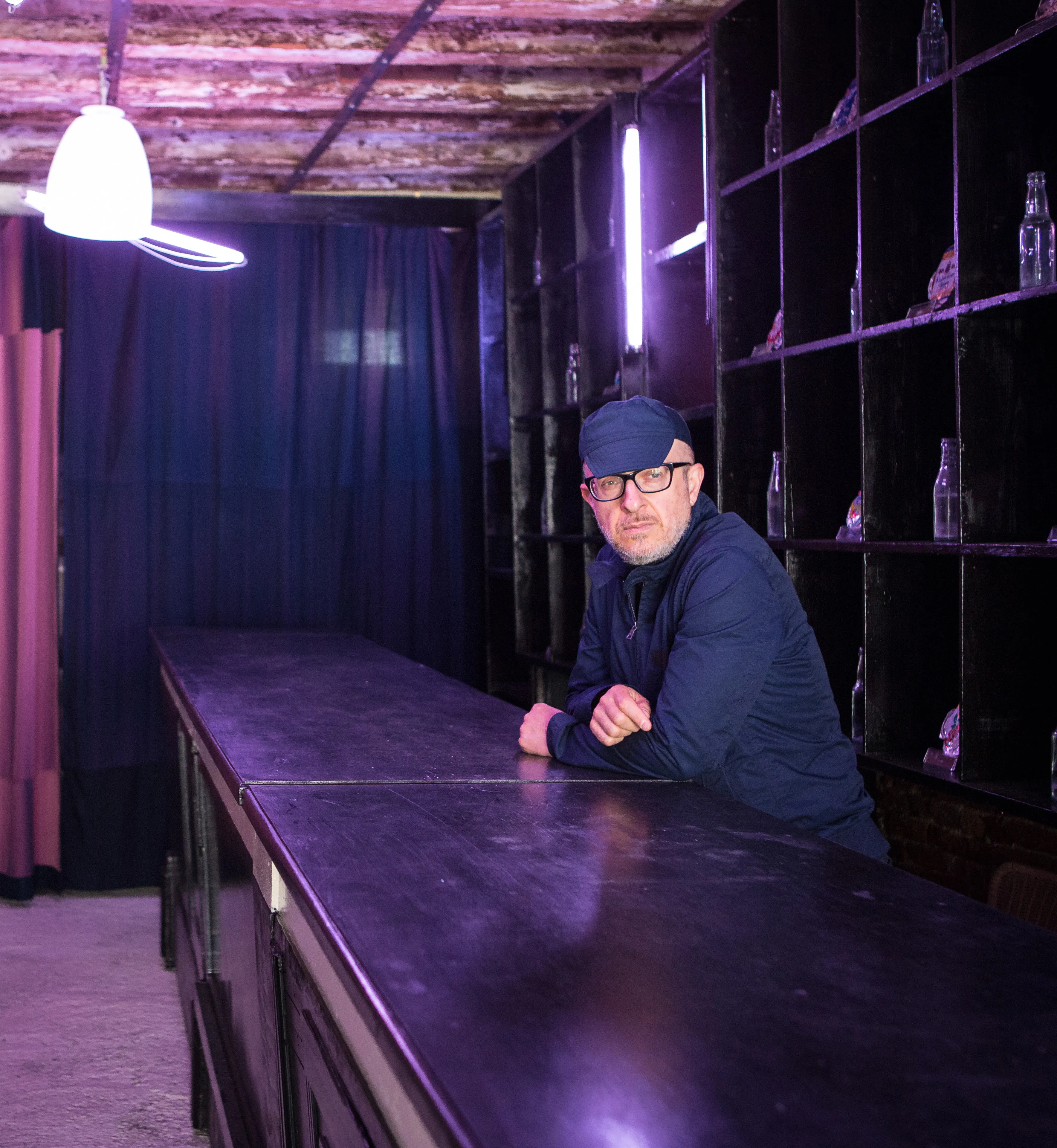 Festival di Spoleto artist rests at purple-lit backstage bar