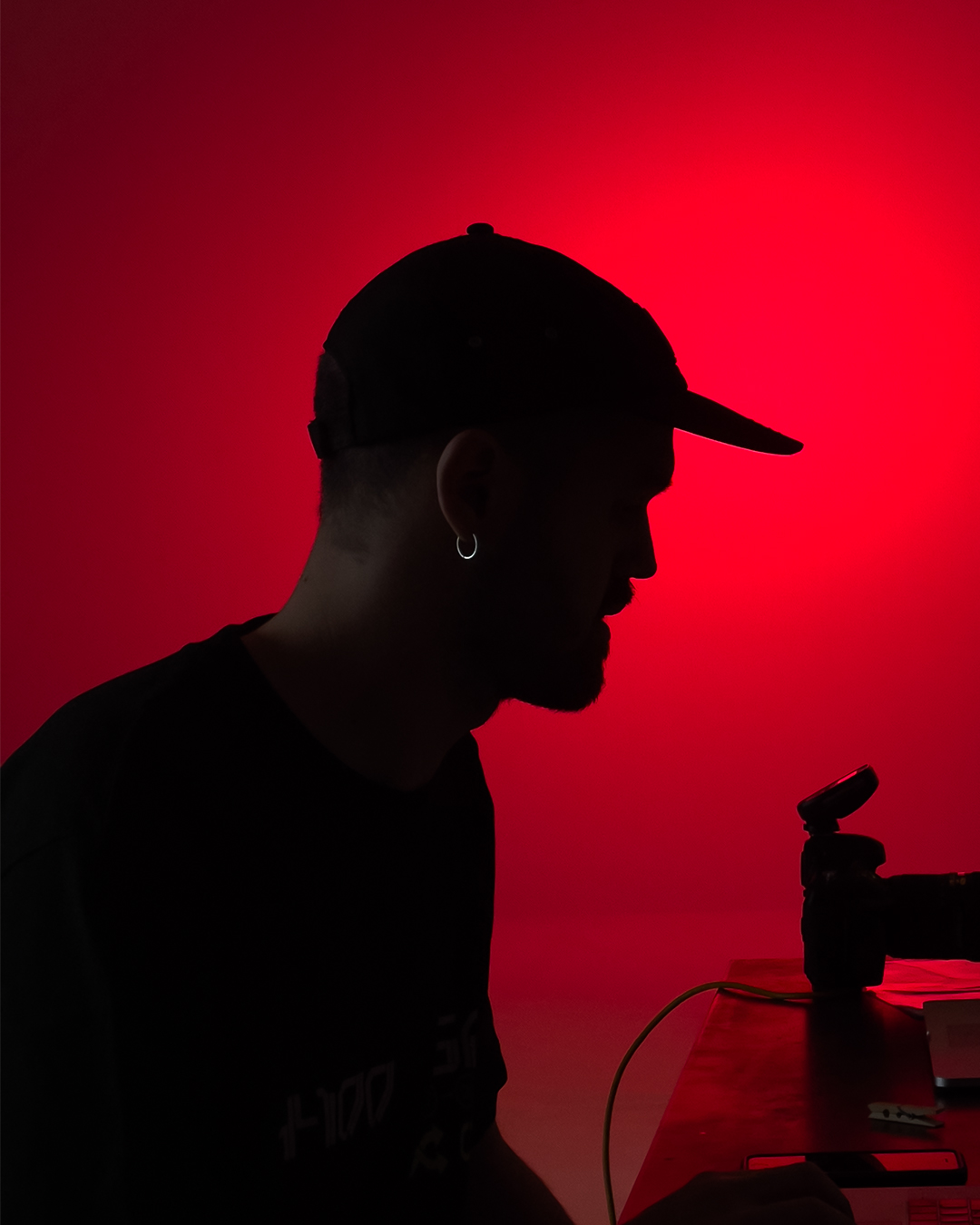 Silhouette at Festival di Spoleto, capturing artistic performance against red backdrop