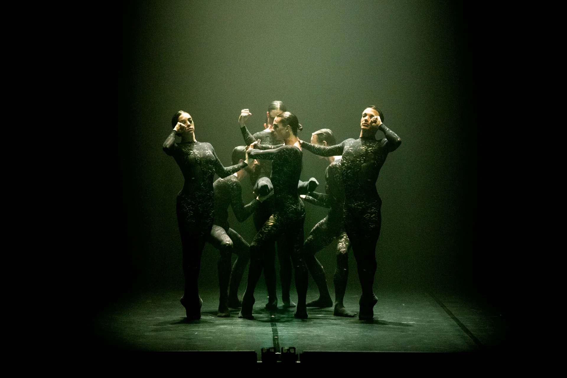 Festival di Spoleto contemporary dance performance with dramatic green-lit stage