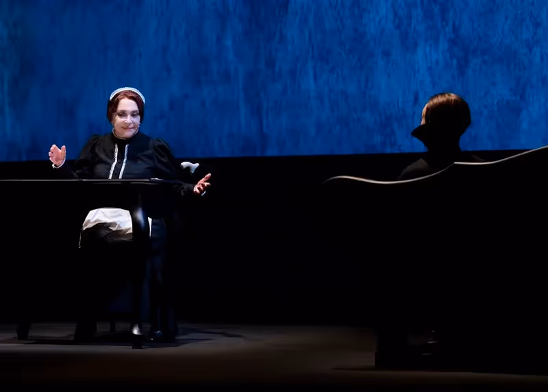 Performance at Festival di Spoleto with dramatic blue stage backdrop