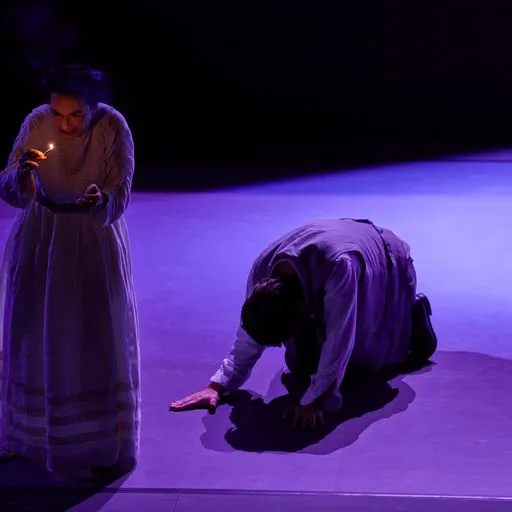 Festival di Spoleto performance with dramatic purple lighting and two performers