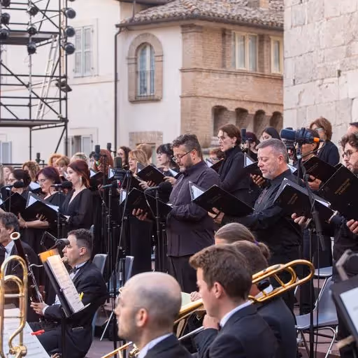 Choir and orchestra performing at Festival di Spoleto in historic Italian piazza