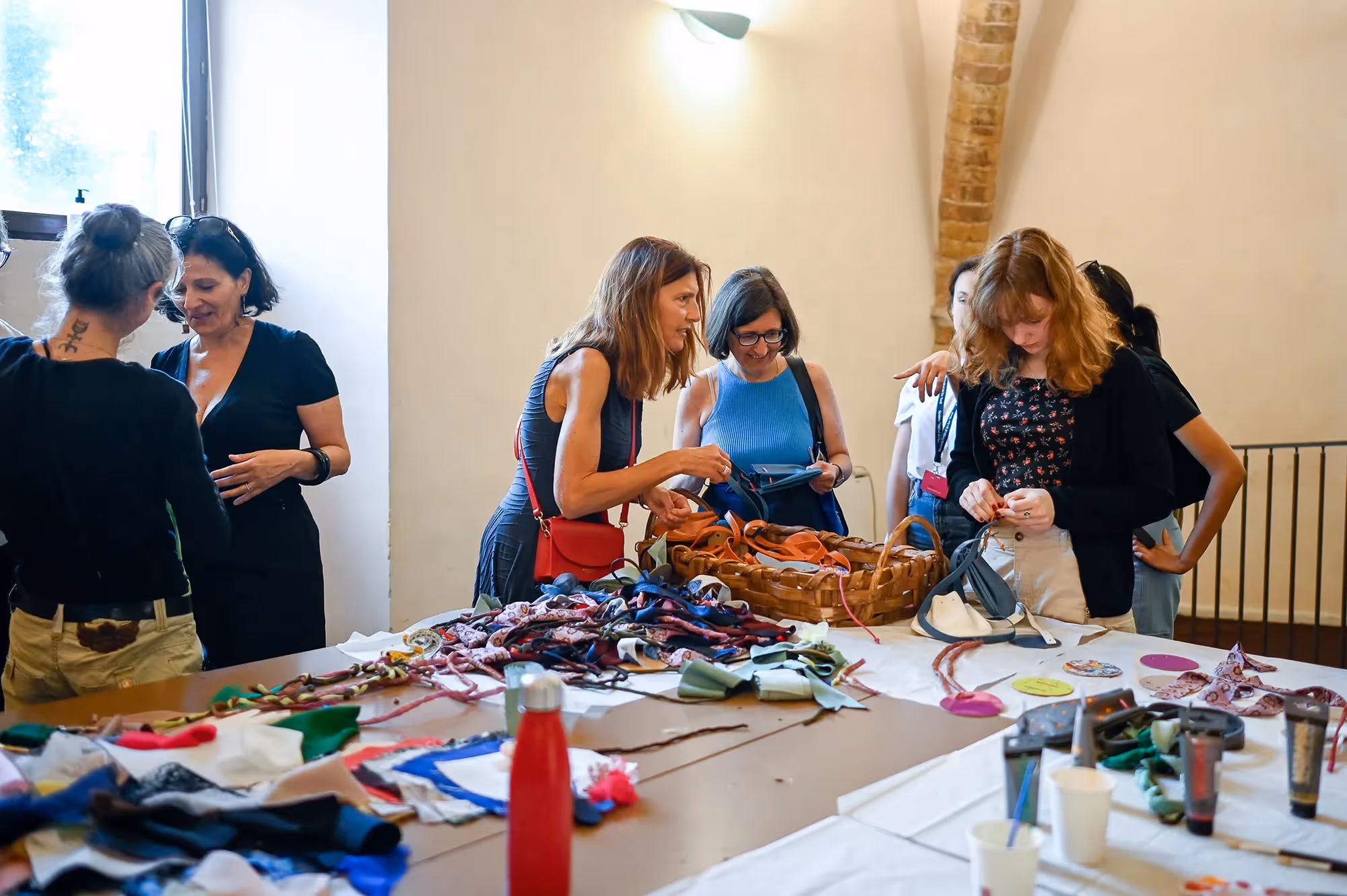 Festival di Spoleto artisans crafting and selecting colorful textiles together