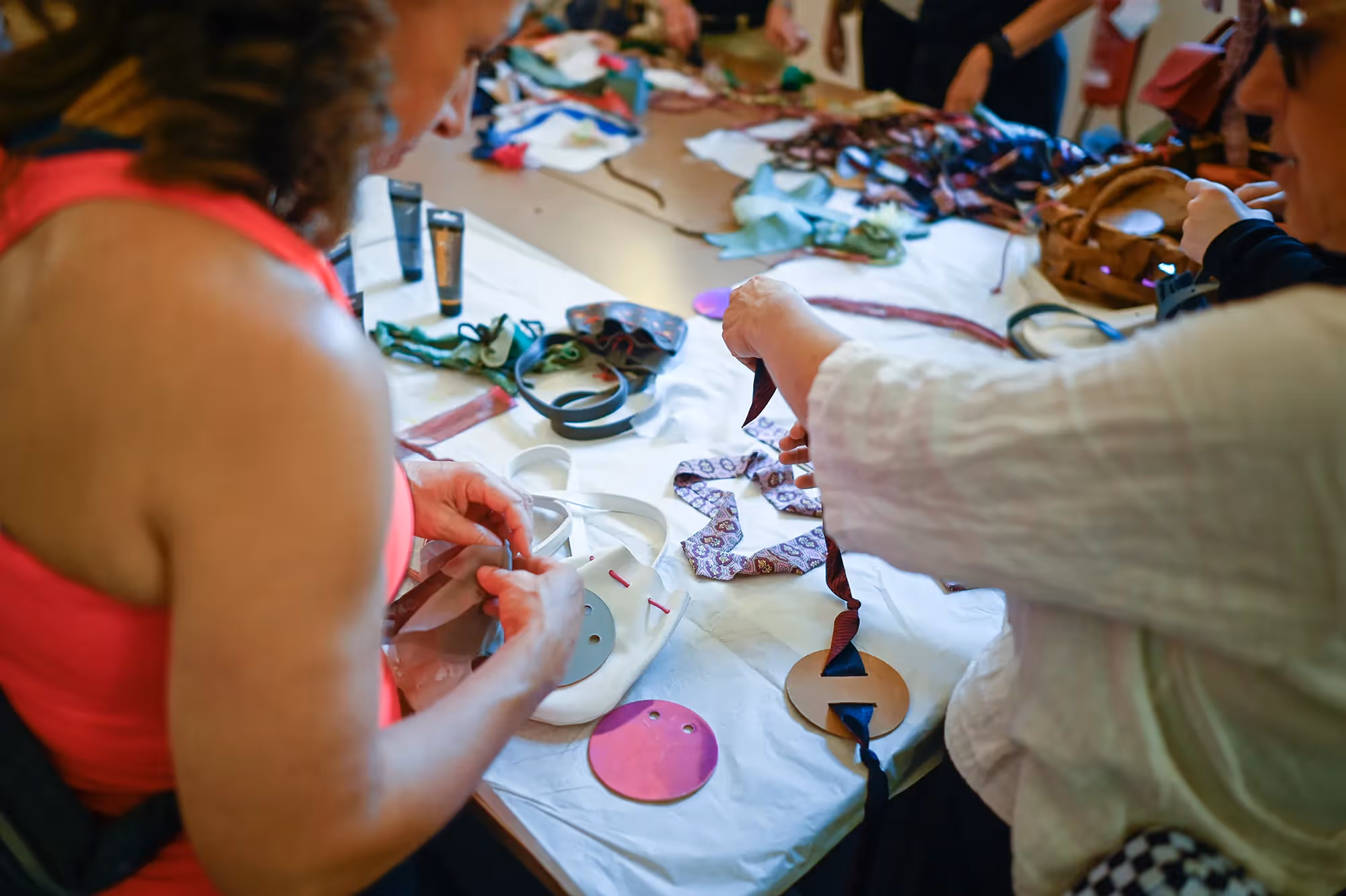 Crafting workshop at Festival di Spoleto with colorful materials and creative hands