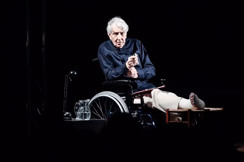 Elderly performer on stage at Festival di Spoleto, seated in wheelchair