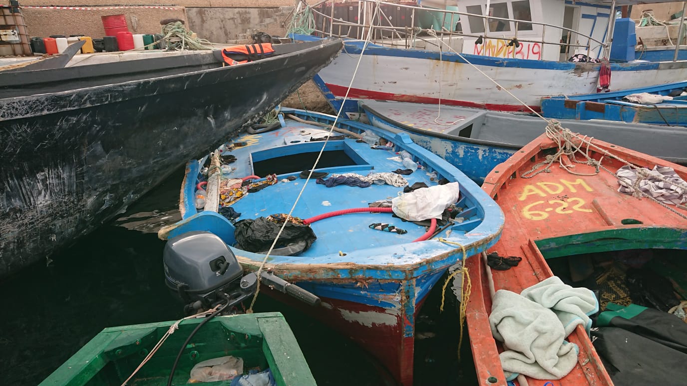Colorful fishing boats clustered together at Festival di Spoleto harbor