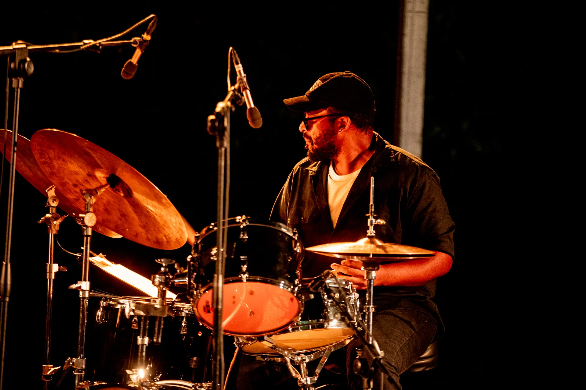 Drummer performing at Festival di Spoleto with dramatic stage lighting