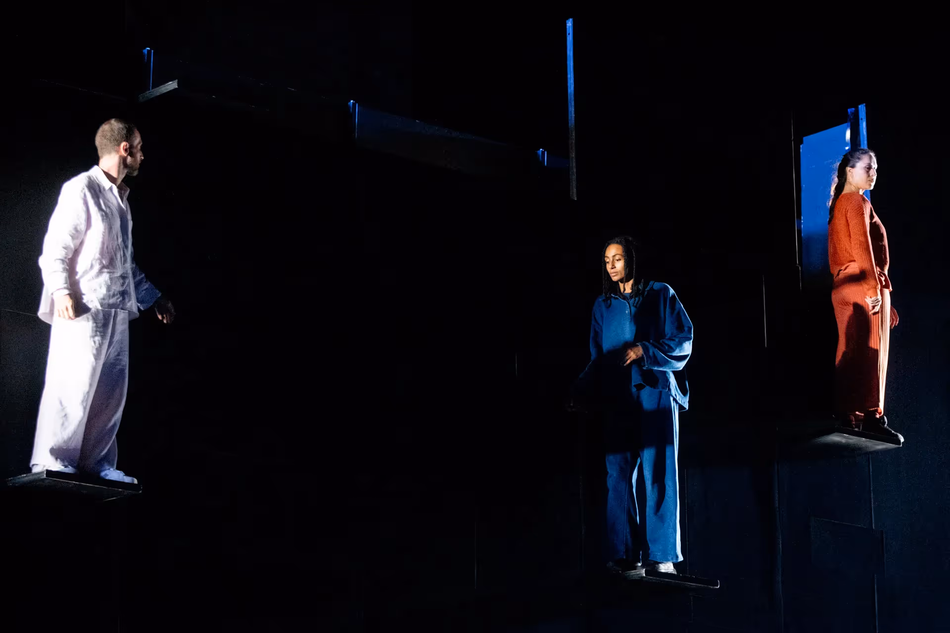 Festival di Spoleto performers in minimalist stage design with colorful costumes