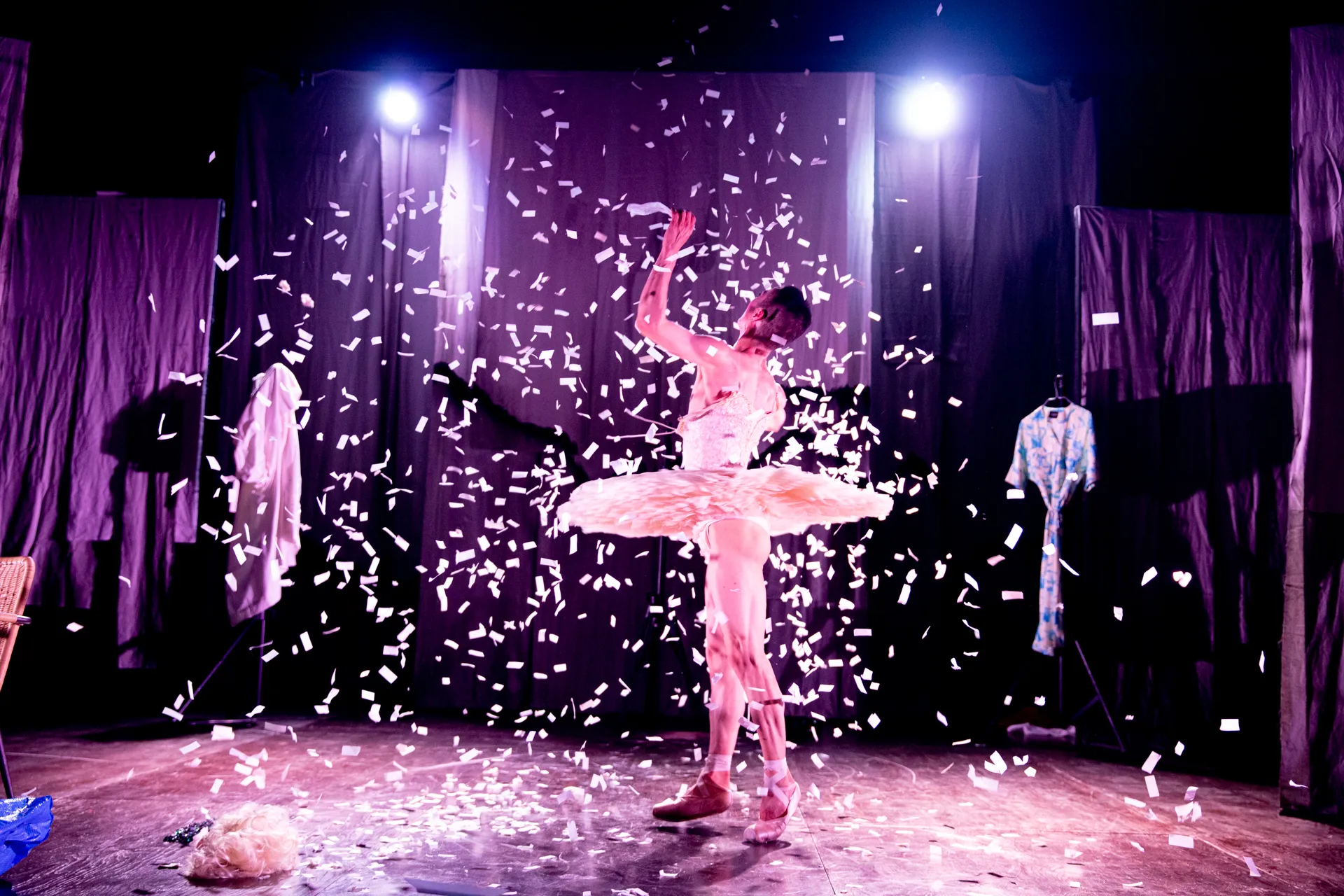 Dancer performs at Festival di Spoleto, surrounded by floating white confetti