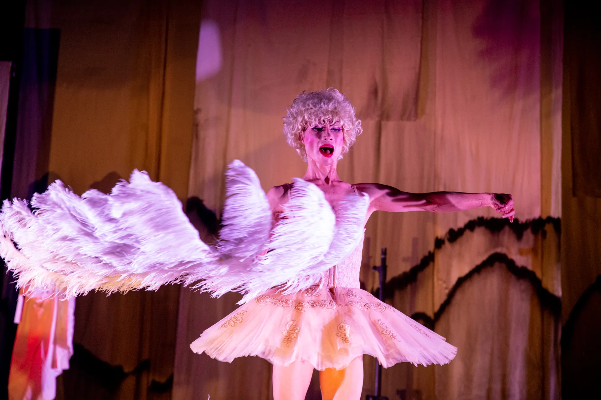 Dramatic performance at Festival di Spoleto, ballet dancer in white tutu