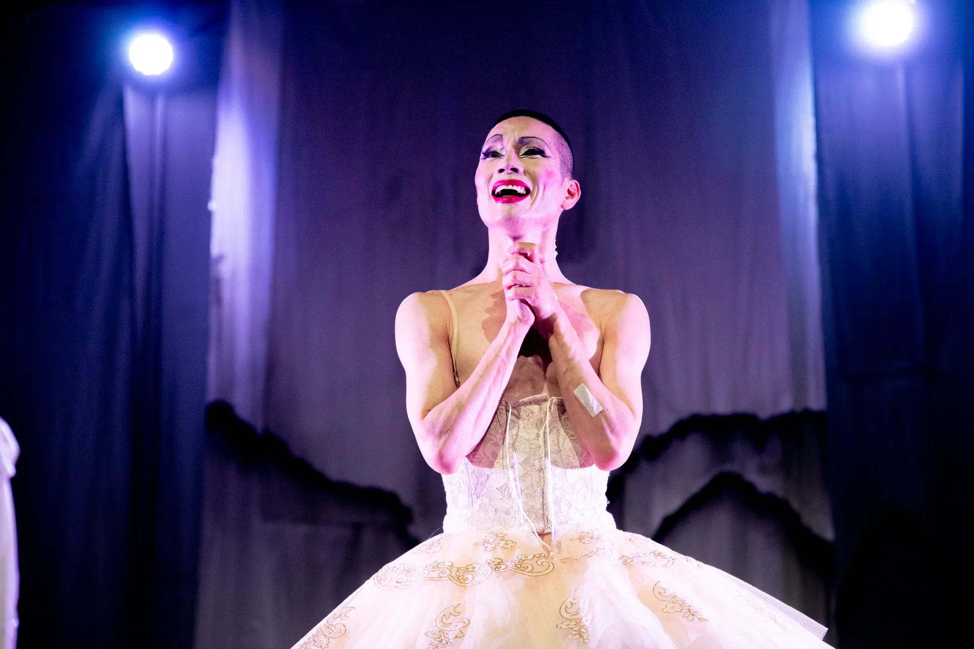Emotional performer on stage at Festival di Spoleto, dramatic ballet performance