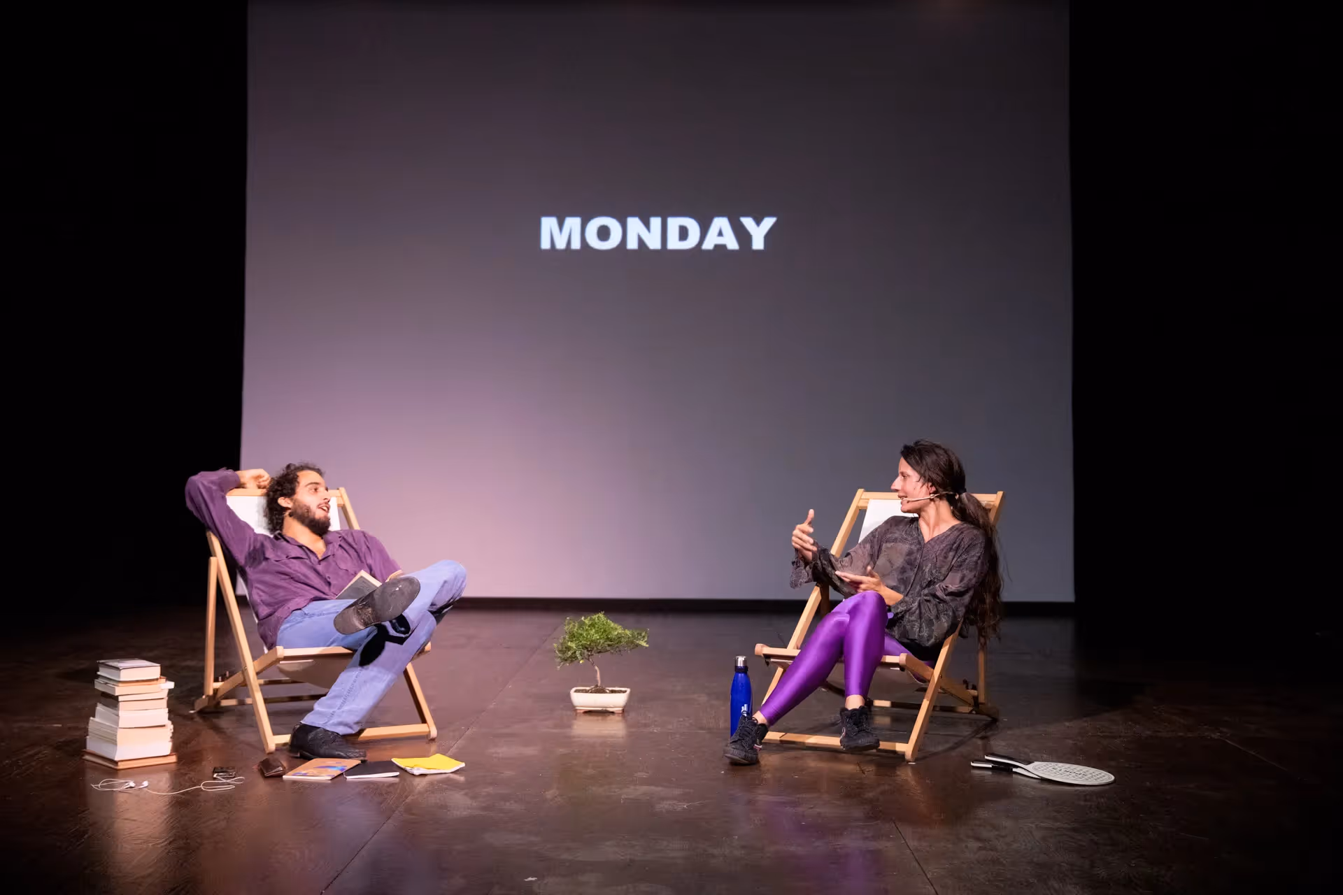 Festival di Spoleto performance with two actors on stage discussing Monday
