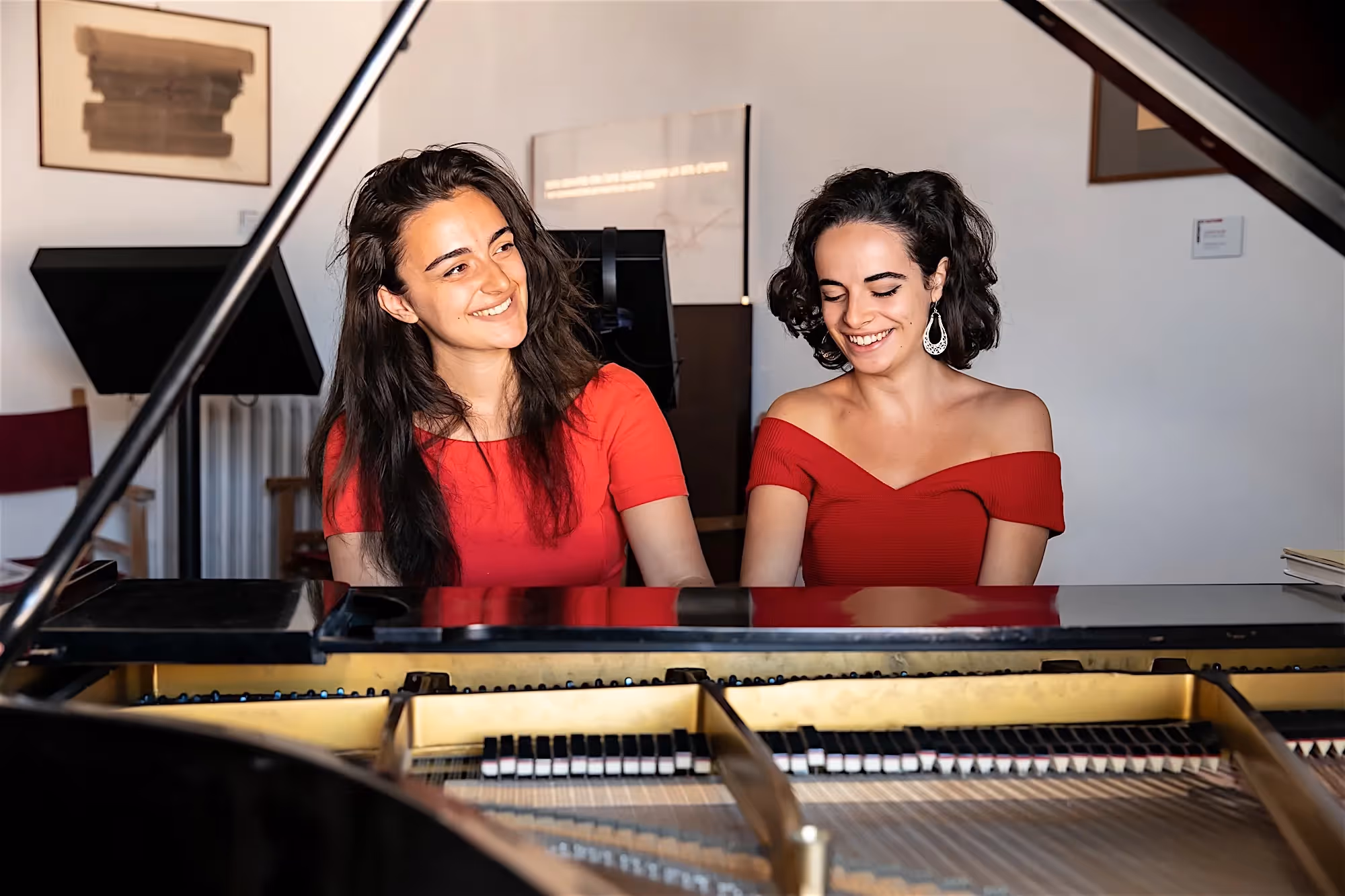 Two musicians in red, preparing for Festival di Spoleto concert