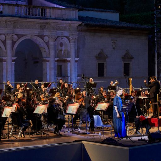 Orchestra performs at Festival di Spoleto against historic architectural backdrop