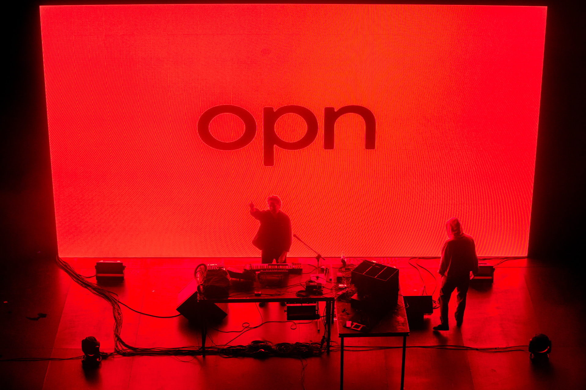 Festival di Spoleto performance with dramatic red backdrop and musicians