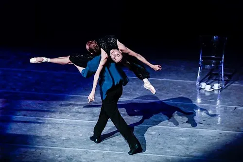 Ballet performance at Festival di Spoleto, dramatic dance on blue-lit stage