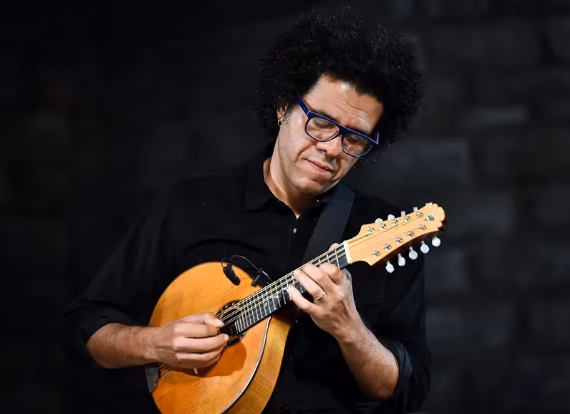 Musician performing at Festival di Spoleto with passionate mandolin performance