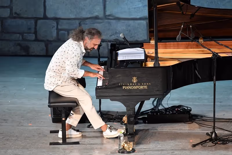 Pianist performing at Festival di Spoleto, playing Steinway grand piano on stage