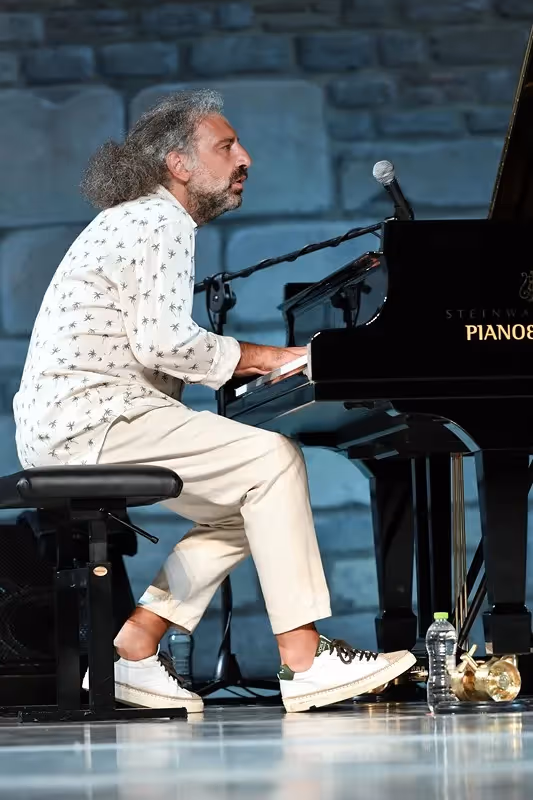 Passionate musician performing at Festival di Spoleto with intense musical expression