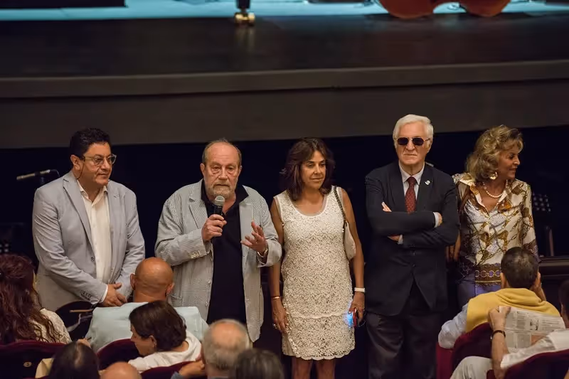 Festival di Spoleto speakers on stage addressing audience during cultural event