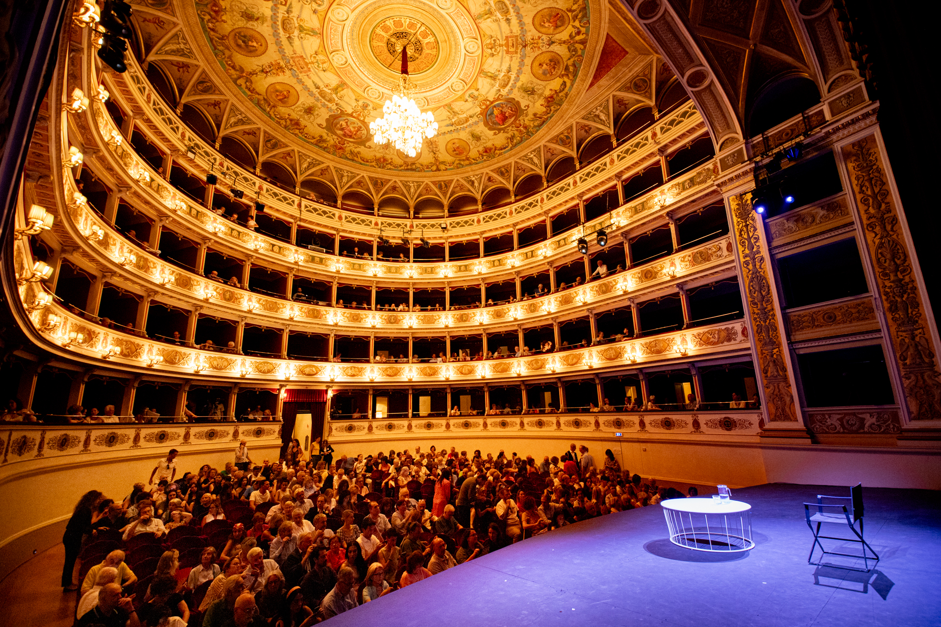 Festival di Spoleto theatre interior with ornate golden balconies and packed audience