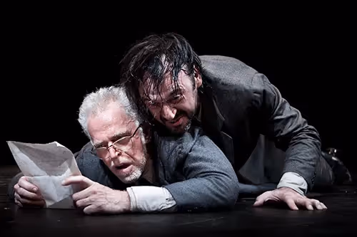 Dramatic performance at Festival di Spoleto with two actors in intense theatrical moment