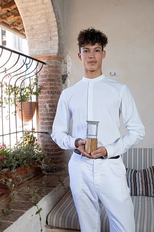 Young performer in white attire at Festival di Spoleto cultural event