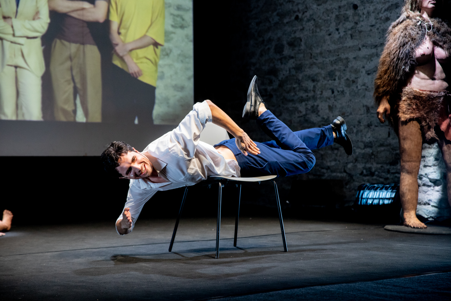 Performer balancing dramatically on chair at Festival di Spoleto performance