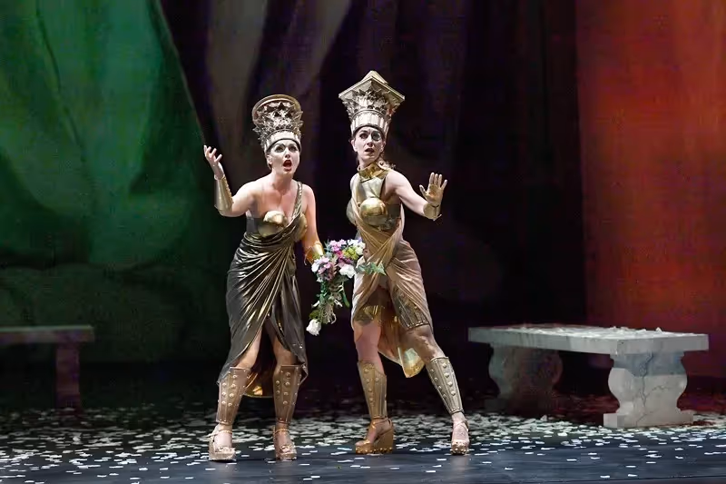 Dramatic performers in golden costumes at Festival di Spoleto theatrical performance