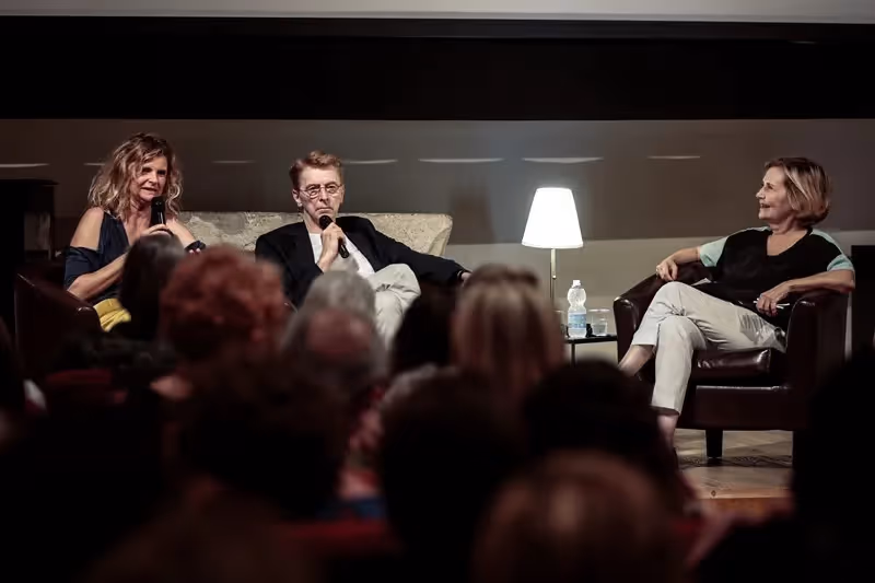 Panel discussion at Festival di Spoleto featuring three speakers on stage